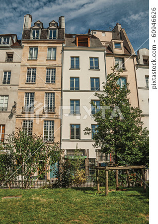 Garden and buildings facade in Paris 60946626