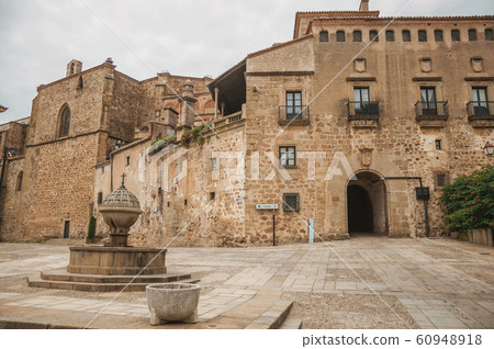 Fountain in square encircled by gothic buildings at Plasencia Fountain in square encircled by gothic buildings at Plasencia 60948918