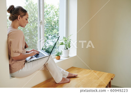 Female student doing homework 60949223