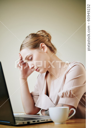 Young woman having headache Young woman having headache 60949232