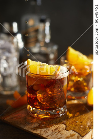 Tasty alcoholic old fashioned cocktail with orange 60949451