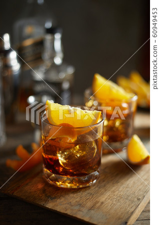 Tasty alcoholic old fashioned cocktail with orange 60949453