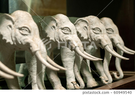 Beautiful Ceramic Elephants Statue on the Table 60949540