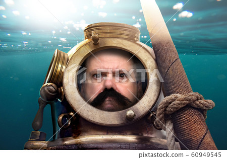 Portrait of man in old diving suit and helmet Portrait of man in old diving suit and helmet 60949545