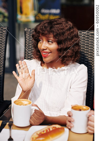Woman at lunch break with friends Woman at lunch break with friends 60950002