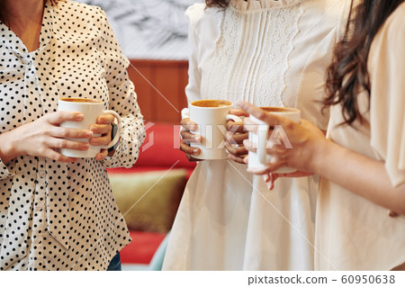 Woman with coffee discussing news 60950638