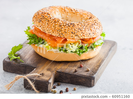 Fresh healthy bagel sandwich with salmon, ricotta 60951160
