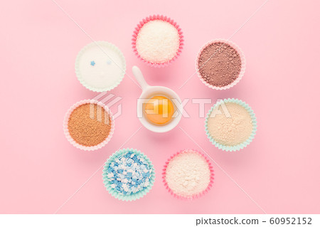 ingredients like a clock, baking time concept, on pink background 60952152