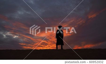 Morocco Merzouga Sahara Desert Sunset and figures Morocco Merzouga Sahara Desert Sunset and figures 60952832