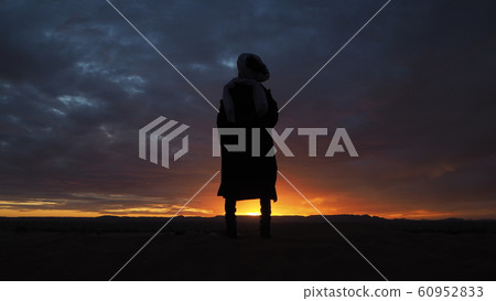 Morocco Merzouga Sahara Desert Sunset and figures Morocco Merzouga Sahara Desert Sunset and figures 60952833