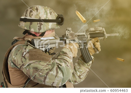 US ARMY soldier shooting from assault rifle 60954463