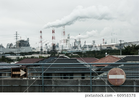 Industrial complex and chimney smoke 60958378