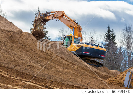 Yellow Excavator at Work in forest 60959488