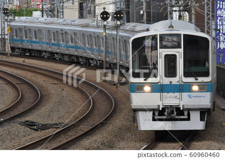 Odakyu 2000 type commuter train 2059F stop at each station bound for Hon Atsugi 60960460
