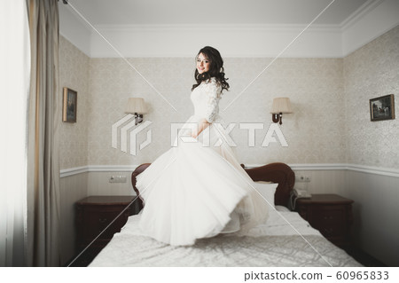 Portrait of a beautiful fashion bride, sweet and sensual. Wedding make up and hair Portrait of a beautiful fashion bride, sweet and sensual. Wedding make up and hair 60965833