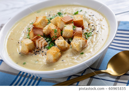 Asiago Roasted Garlic Cauliflower Soup in a bowl Asiago Roasted Garlic Cauliflower Soup in a bowl 60965835