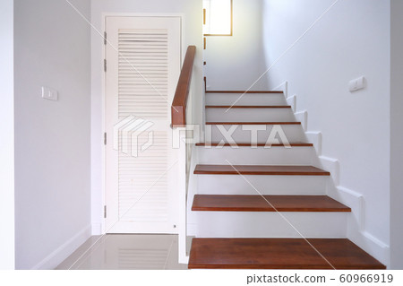 brown wooden stair and white wall in residential house brown wooden stair and white wall in residential house 60966919