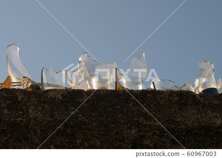 Glass pieces on the fence 60967003
