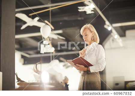 Female Art Gallery Manager Reading Book Female Art Gallery Manager Reading Book 60967832