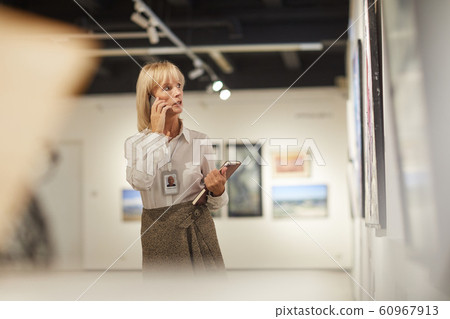 Mature Woman Managing Art Gallery Mature Woman Managing Art Gallery 60967913