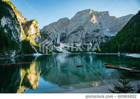 Braies Lake in Dolomites mountains forest trail in 60969882