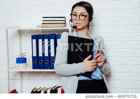 business girl Secretary sits in a white Office call center business girl Secretary sits in a white Office call center 60970728