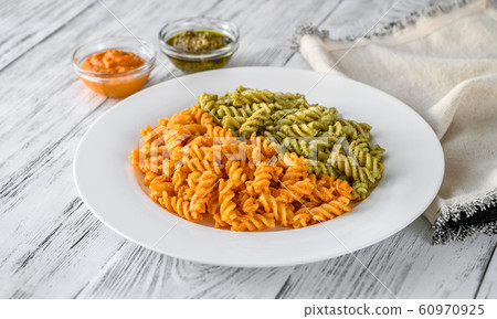 Fusilli with traditional and tomato pesto Fusilli with traditional and tomato pesto 60970925