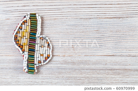 brooch from various glass bugles and beads on gray brooch from various glass bugles and beads on gray 60970999