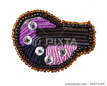 embroidered brooch decorated by bugles isolated embroidered brooch decorated by bugles isolated 60971009