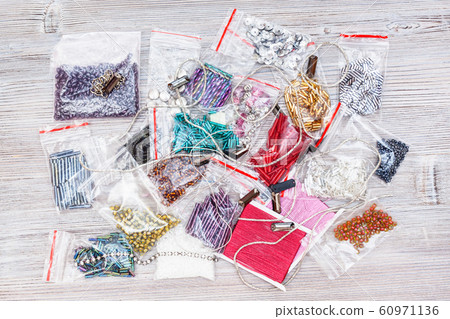 various embroidery items on gray wooden board various embroidery items on gray wooden board 60971136