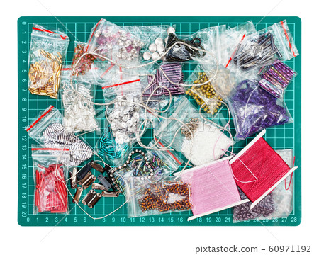 various embroidery items on cutting mat isolated various embroidery items on cutting mat isolated 60971192
