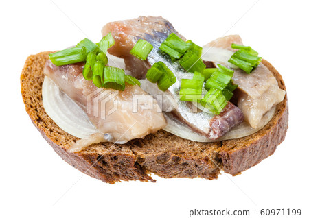 open sandwich with rye bread, herring and onion 60971199