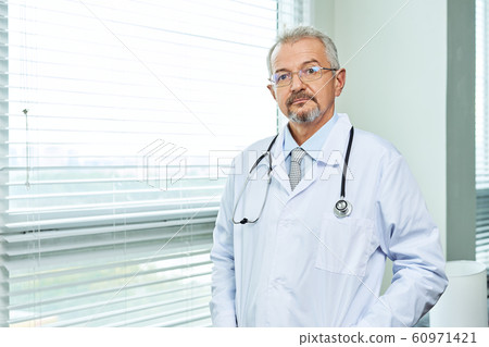 Medical doctor or physician in white gown uniform with stethoscope in hospital or clinic Medical doctor or physician in white gown uniform with stethoscope in hospital or clinic 60971421