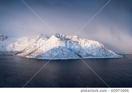 Snow mountain in blizzard on arctic circle at 60971666