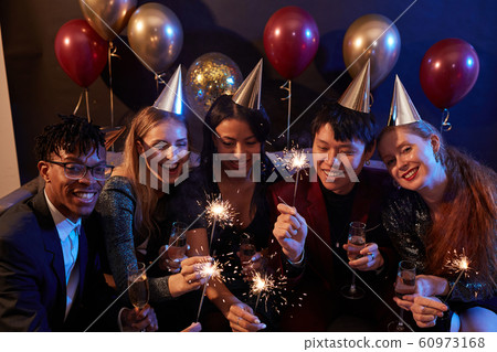 Friends Enjoying Christmas Party in Nightclub 60973168