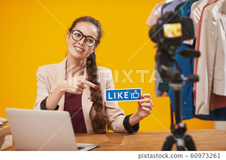 Social Media Influencer Holding Like 60973261