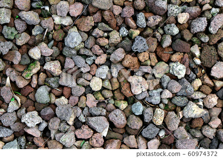 Close-up photo for background with various colors of water-absorbing pebbles covering the garden Close-up photo for background with various colors of water-absorbing pebbles covering the garden 60974372