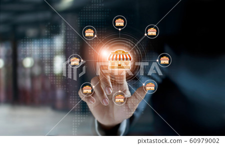 Businessman hand touching icon global network connection on franchise marketing system. Branch of market and customer. Modern technology business. 60979002