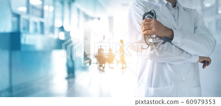 Healthcare and medical concept. Medicine doctor with stethoscope in hand and Patients come to the hospital background. 60979353
