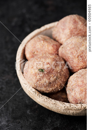 raw homemade meatballs 60984985