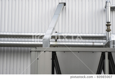 Air vent ducts of air conditioning and ventilation system on the wall. 60985007