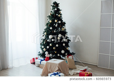 Christmas tree with gifts decor lights garlands new year Christmas tree with gifts decor lights garlands new year 60985973