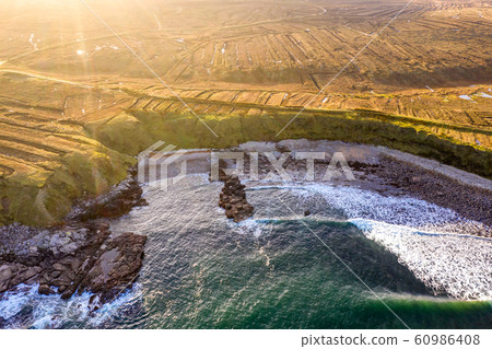 The coastline between Meenlaragh and Brinlack : Tra na gCloch in County Donegal - Ireland - Signs of massive peat harvesting The coastline between Meenlaragh and Brinlack : Tra na gCloch in County Donegal - Ireland - Signs of massive peat harvesting 60986408