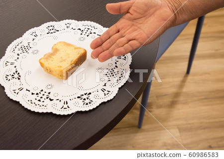 Hand showing pound cake Hand showing pound cake 60986583