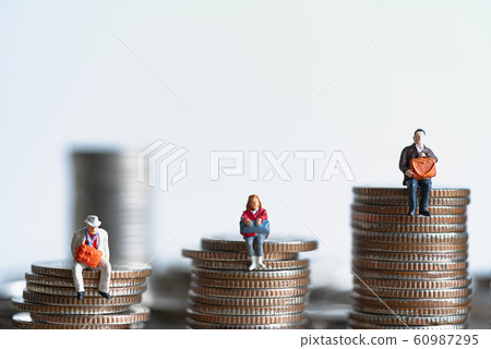 Elderly people sitting on coins stack. 60987295