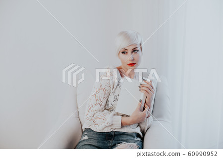 beautiful blonde woman with short book reads book training 60990952