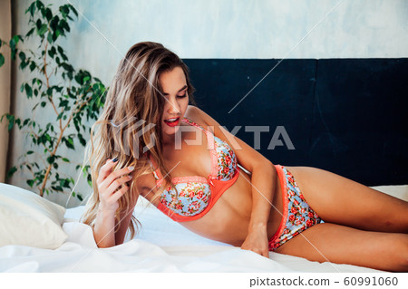 fashion portrait of a beautiful woman in underwear home in bedroom fashion portrait of a beautiful woman in underwear home in bedroom 60991060