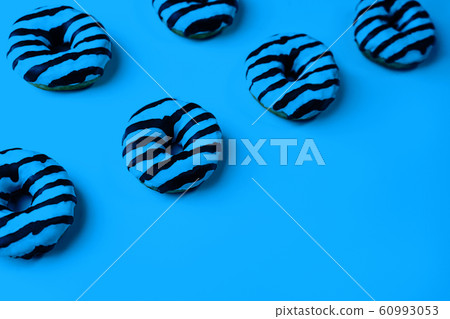 Sweet donuts with on classic blue background. 60993053