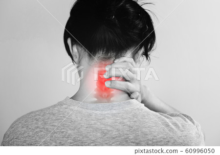 Neck Pain. a man touching neck at pain point 60996050