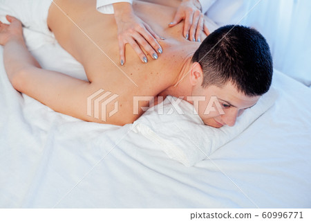 a massage therapist makes therapeutic massage Spa a massage therapist makes therapeutic massage Spa 60996771